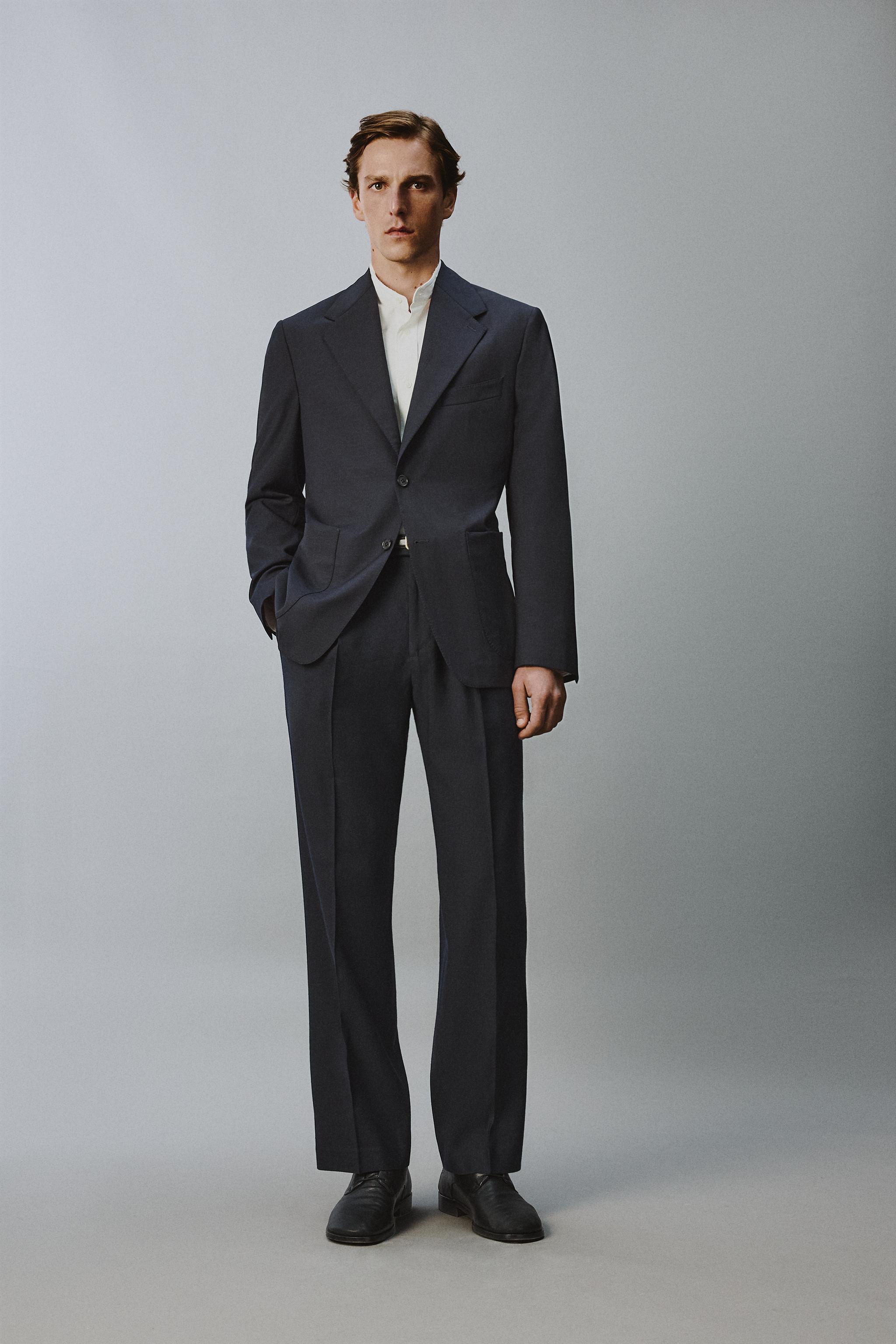 100% WOOL RELAXED FIT PLEATED PANTS